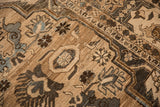 Low pile texture of a distressed Khoy carpet showing its geometric cartouche and blossom motifs.