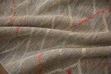 Dense, hand-knotted pile of a Moroccan design carpet showing its textured silver weave.
