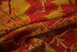 The rich texture of the short wool pile in saffron yellow and cochineal red.