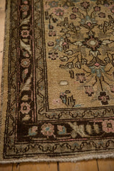 Meandering vine and floral border in brown, pink, and sand on a vintage distressed Bibikabad runner.