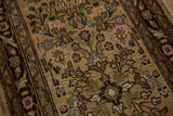 Distressed low pile showing knot heads and floral patterns on a vintage Bibikabad runner.