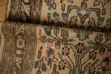 Worn knot heads and textured pile of a distressed Bibikabad rug with beige, pink, and blue floral motifs.