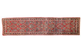 Vintage Sarouk rug runner with floral bouquets in a lattice design on a cherry red field.