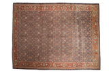 Distressed vintage Mahal carpet, charcoal field with lattice palmettes, and terracotta lotus borders.