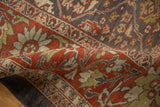 Textured pile of vintage Distressed Mahal rug in terracotta, charcoal, and sage.