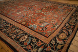 Corner of an antique Sultanabad with a red paisley field and a charcoal black Herati border.