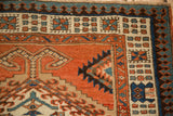 Corner view of an antique Serab runner showing its reciprocating pawn outer border.
