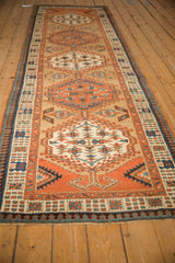 Low-angle view of a Serab runner's intricate pawn border and medallion column.