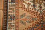 Reciprocating pawn outer border and meandering vine inner border of an antique Persian Serab runner.