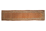 Distressed vintage Malayer rug runner with a geometric plant design in sandalwood, brown, and faded blue.