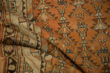 The supple drape and warm, time-softened colors of a hand-knotted vintage Malayer rug.