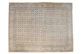Vintage Persian Mahal carpet with a distressed allover Herati pattern in blue on a beige field.