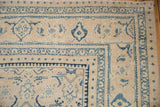 Detail of the dusty blue Turtle Samovar border on the worn ivory corner of a vintage Mahal rug.