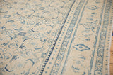 Angled view of the Turtle Samovar border and worn, low pile of the distressed Mahal carpet.