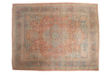 Distressed vintage Meshed carpet with cherry red medallion and slate blue floral design.