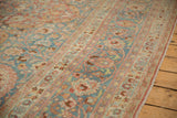 Vintage Distressed Meshed rug, soft blue field, sprawling cherry red and blush floral vines.