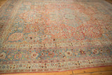 Distressed Meshed carpet detail: slate blue borders, intricate red floral field, visible wear.