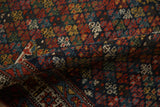 The short, dense pile and colorful trefoil blossoms of a vintage Kurdish Hamadan rug runner.