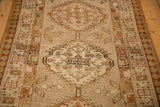 A view down the length of the vintage Serab runner showing its interconnected geometric medallions.