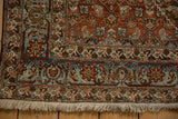 Corner view showing the Samovar Turtle border and hand-knotted fringe of a vintage Bijar rug.