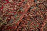 Vintage Sarouk carpet with dense cherry red and dusty teal scrolling floral vines.