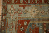 Evenly worn pile and wide geometric border on the corner of a vintage Malayer rug.