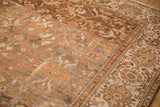Worn Malayer carpet field of coffee brown vines, dusty gold arabesques, and floral border.