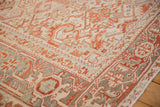 Geometric Turtle Samovar border in terracotta and silver on a distressed vintage Heriz carpet.
