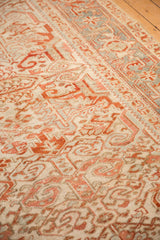 Angled view of the vintage Heriz carpet's low-pile texture and geometric Turtle Samovar motif.