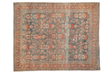 Distressed Bibikabad carpet with large-scale florals in terracotta and rose on an abrashed teal field.