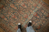 Overhead view of a vintage Bibikabad carpet's abrashed ground and allover floral vine pattern.