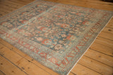 Angled view of the Bibikabad carpet's heavily abrashed ground with terracotta floral details.