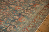 Angled view of the nuanced floral detailing and abrashed texture on the distressed Bibikabad carpet.