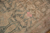 Worn, hand-knotted pile of a distressed Bijar with boteh and floral motifs in teal and pink.