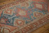 Low pile and time-softened colors on a vintage Hamadan rug with oversized geometric medallions.