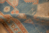 A soft fold in the antique Persian runner highlights its evenly worn, ribbed pile texture.