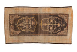 Antique Tibetan rug with a double medallion and cloudband spandrels in coffee brown and saffron yellow.