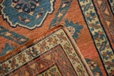 Folded corner of an antique Persian rug revealing its hand-knotted foundation and side selvage.
