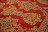 Close-up of the hand-knotted weave and low pile on a vintage Turkish Oushak carpet.