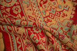 Hand-knotted texture and mostly even wear on a vintage Oushak carpet in cherry red and saffron.