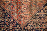 Vintage Mahal carpet detail, henna plant motifs, navy and madder abrash, expressive border.