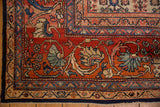 Vintage Mahal carpet detail: madder root red field, expressive scrolled vine border, patina.
