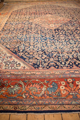 Vintage Mahal carpet's madder root red border with intricate arabesque and floral motifs.