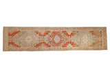 Distressed Malayer runner with stepped terracotta medallions on a silver and beige abrashed field.