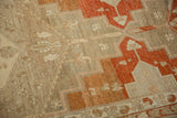 Abrashed ground and stylized animal figures on a distressed Persian Malayer rug runner.