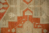 Stepped terracotta pattern on the heavily abrashed and worn ground of a vintage Persian Malayer rug.