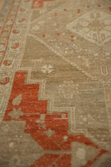 Angled close-up of the distressed, low pile and stepped terracotta motifs on a Malayer runner.