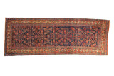 Antique Bijar rug runner with an allover Herati design in brick red and blue over an indigo field.