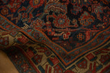 Close-up on the dense, hand-knotted pile and Herati pattern of a draped antique Bijar rug.