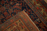 Folded corner of an antique Bijar rug showing the dense, even pile and tightly woven hand-knotted back.